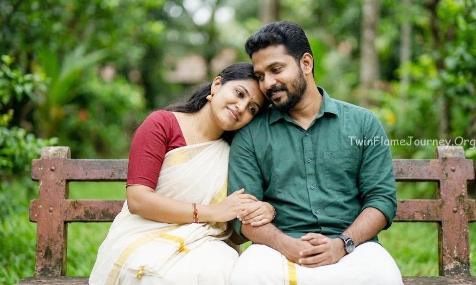 A South Indian Twin Flame couple experiencing a deep connection and comfort in a Kerala garden.